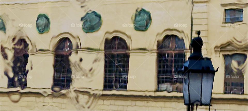 These old fashioned buildings are located in the inner city of “Munich”, capitol of “Bavaria” by the river “Isar” and are seen entirely reflected in the water. 2024. Hypnotic Productions