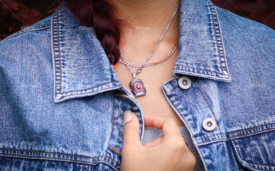 Stylish jewellery on a woman dressed in denim