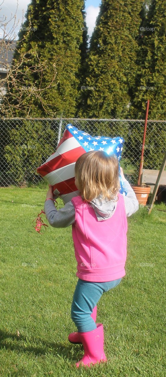 playing with flag balloon