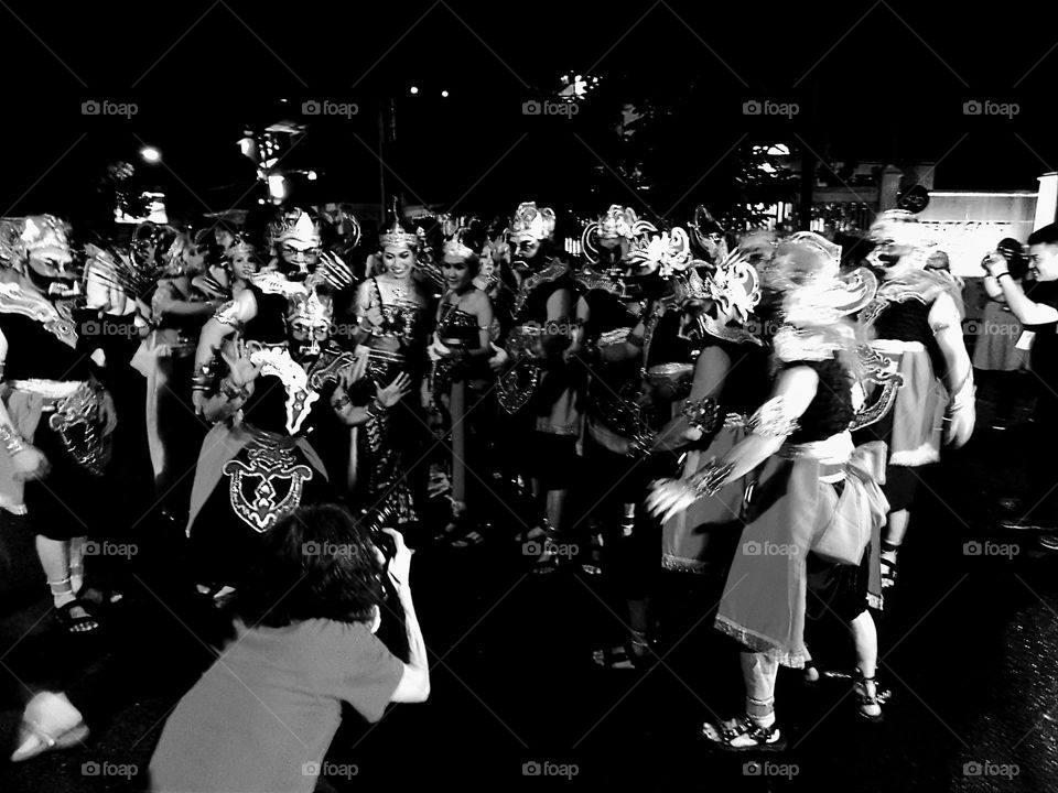 A portrait of the participants of a traditional cultural carnival in the city of Yogyakarta wearing traditional clothes typical of wayang orang performances