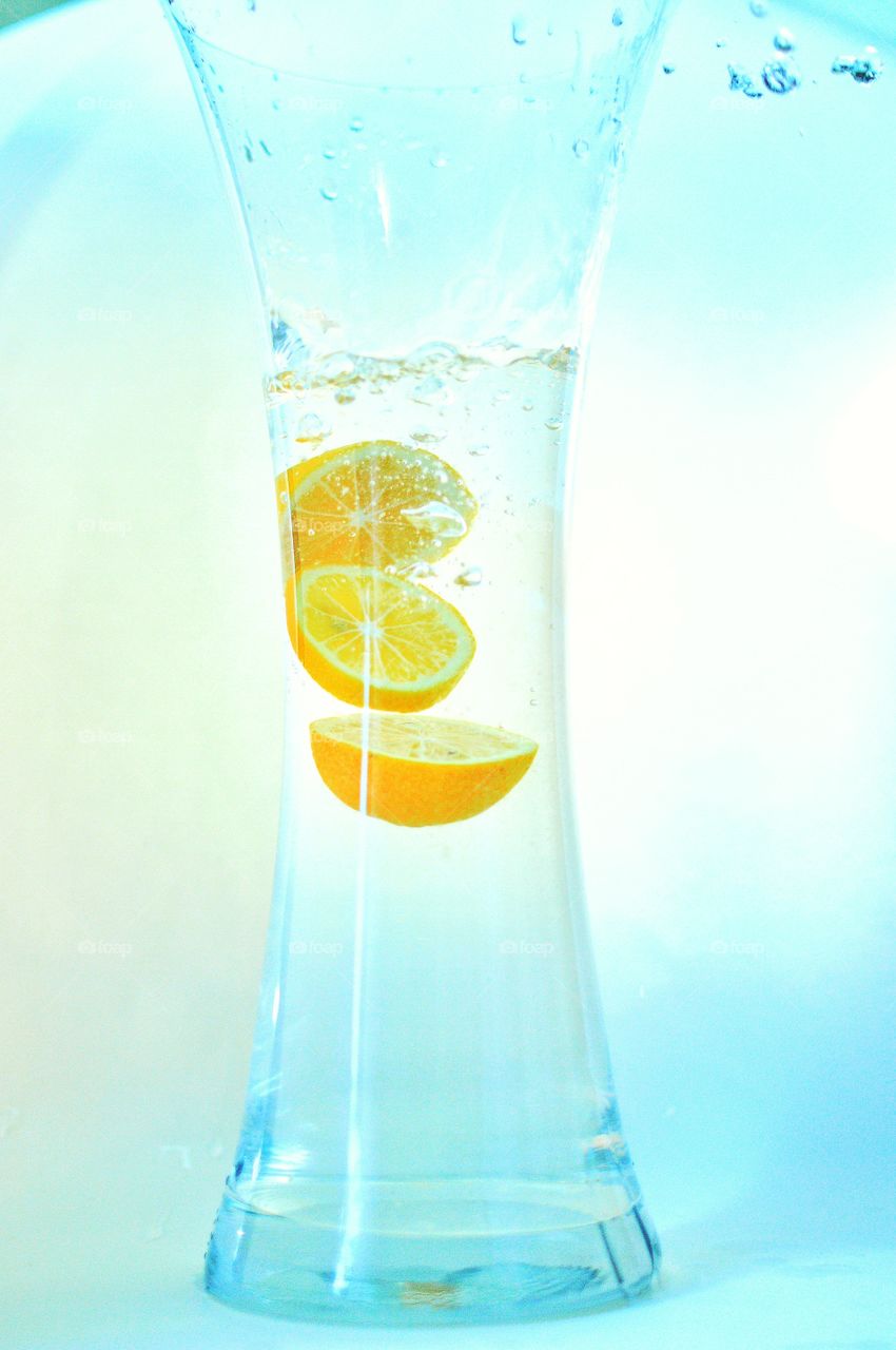 The citrus fruit in water . The citrus fruit and water 