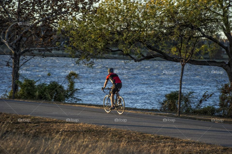 Biker by lake