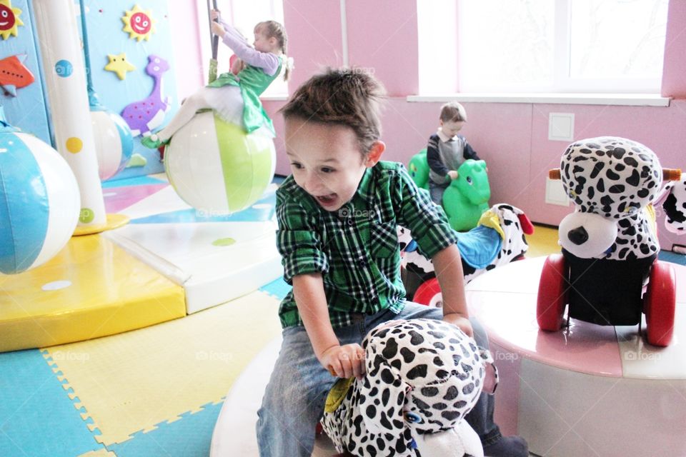 A child is having fun in the game room