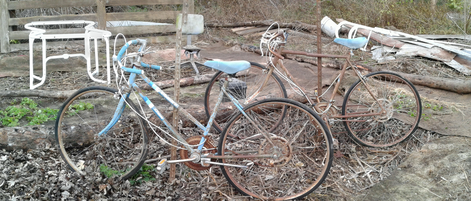 these bikes were purposely propped up for the artistic value that they have