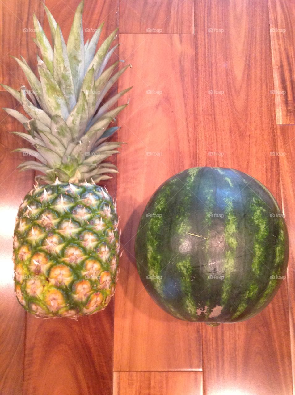 A pineapple and a watermelon.