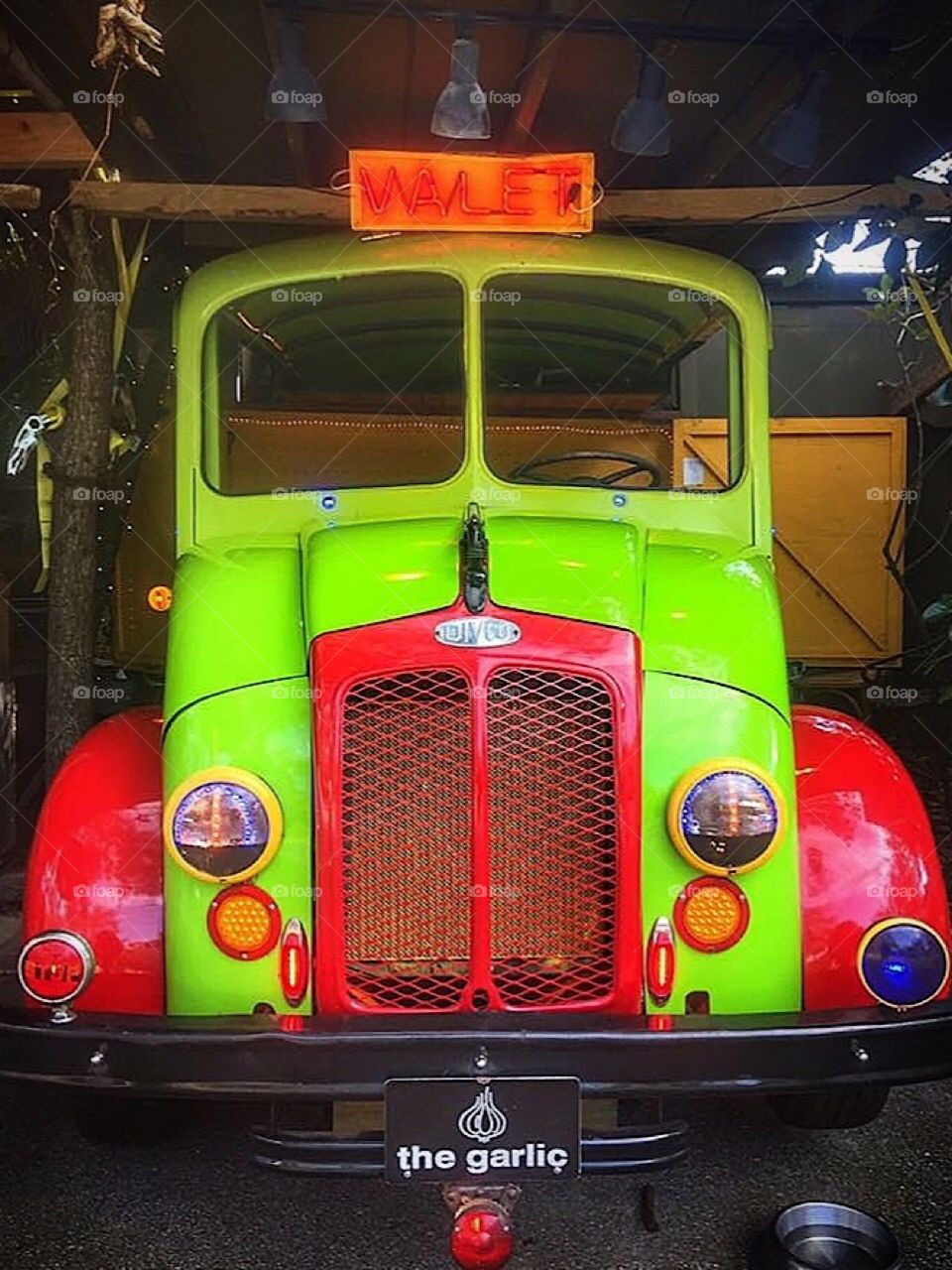 Bright green and red painted old vintage retro truck