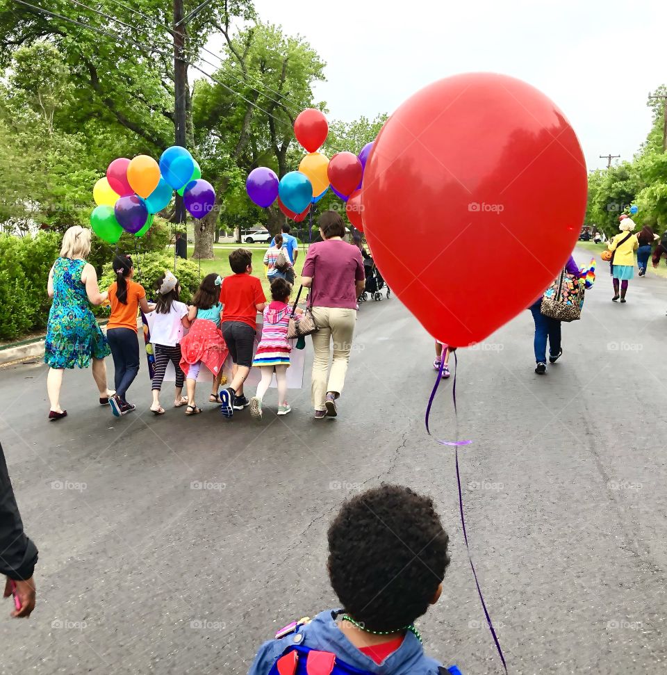 Marching in a parade with family & friends can make any little one's day, especially when balloons are involved.