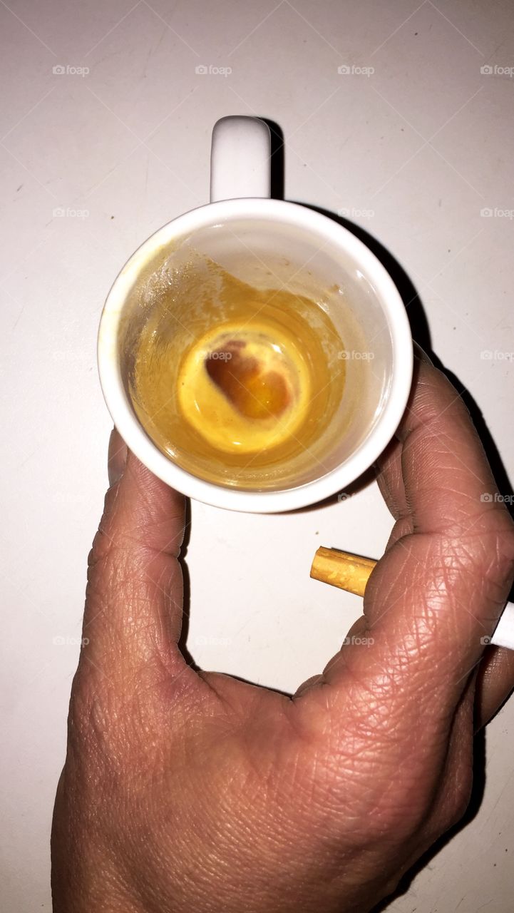 Cup of coffee empty and cigarette