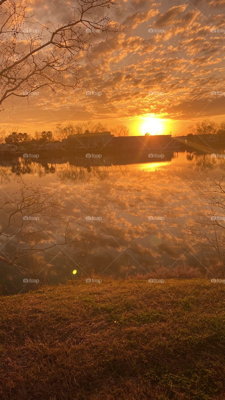 This is a Reflection from Top to Bottom or Top Of Lake Waters. Sunset colors are inviting more from the sunset. 