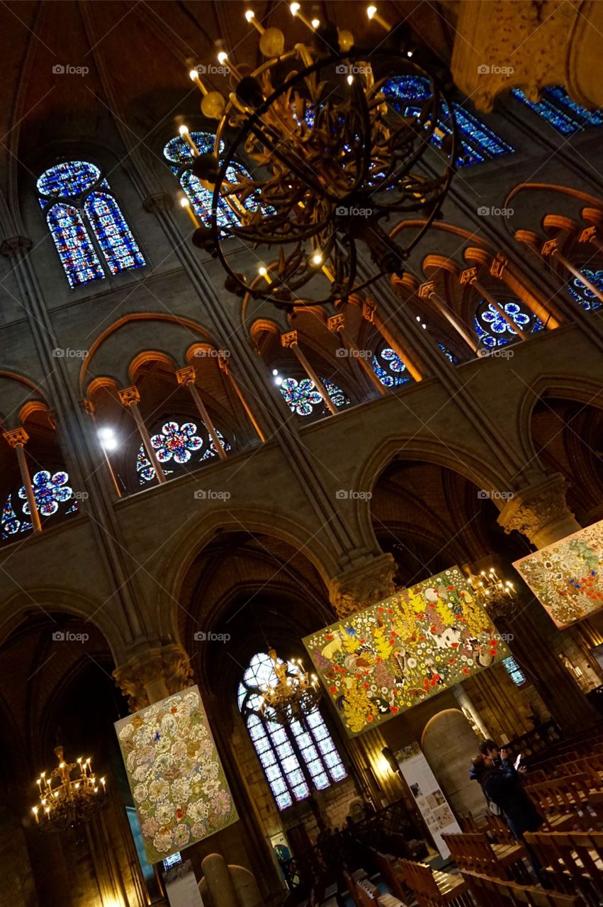 Stained glass and smart exhibit at Notre-Dame Cathedral, Paris 