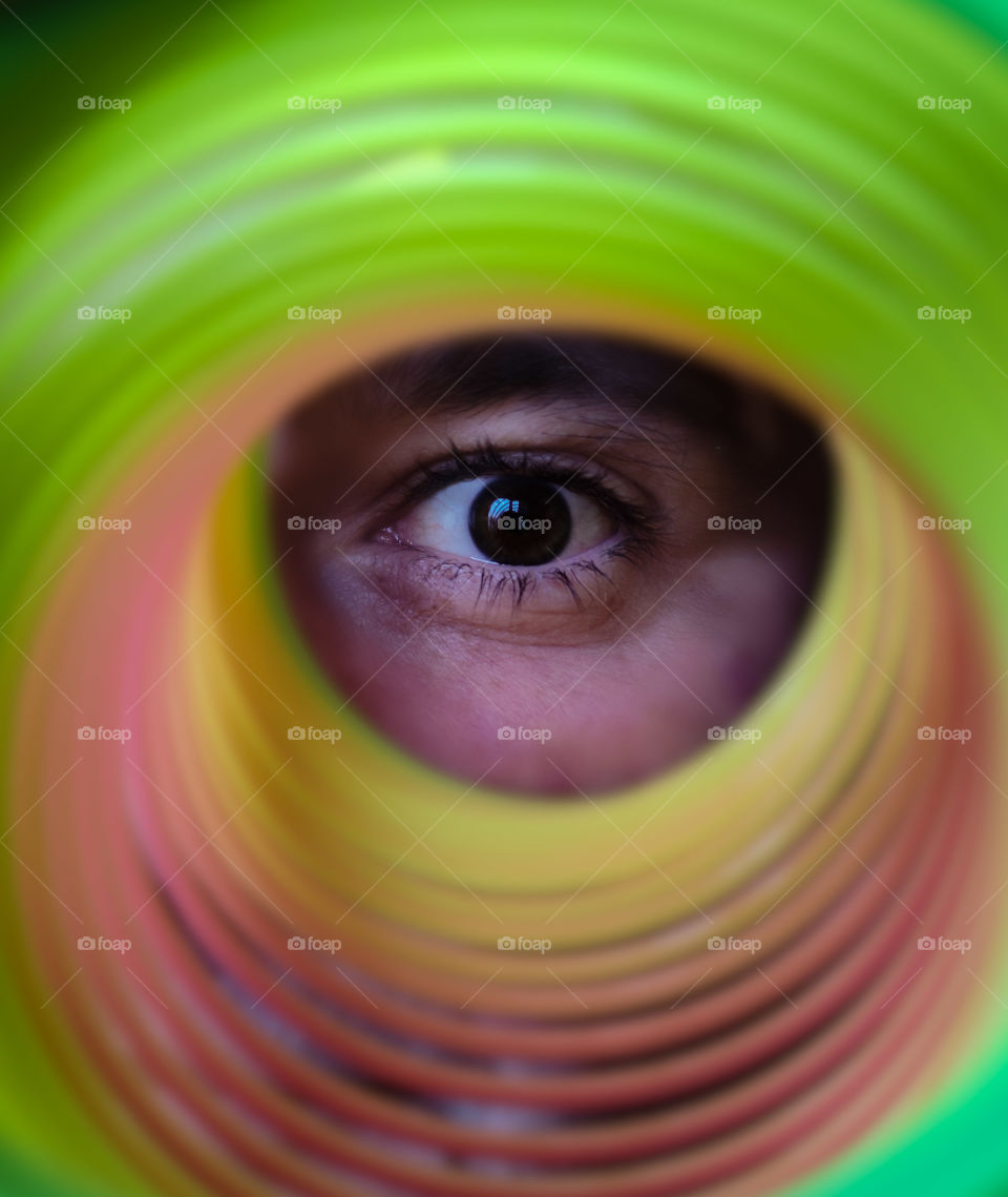 Wide open eye in colorful perspective