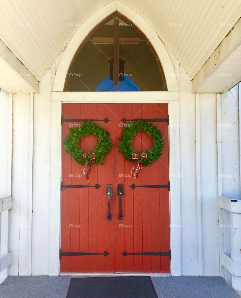 Wreaths on red church doors