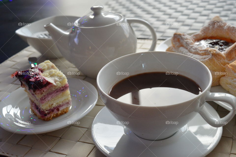 Slice of cake with hot drink