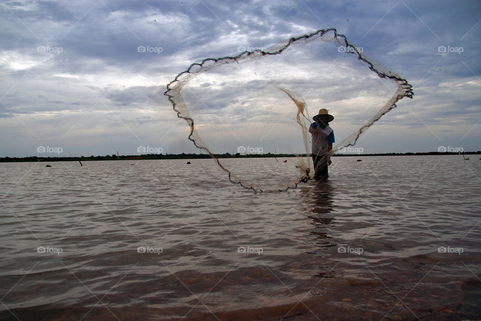 fishermen throw nets.