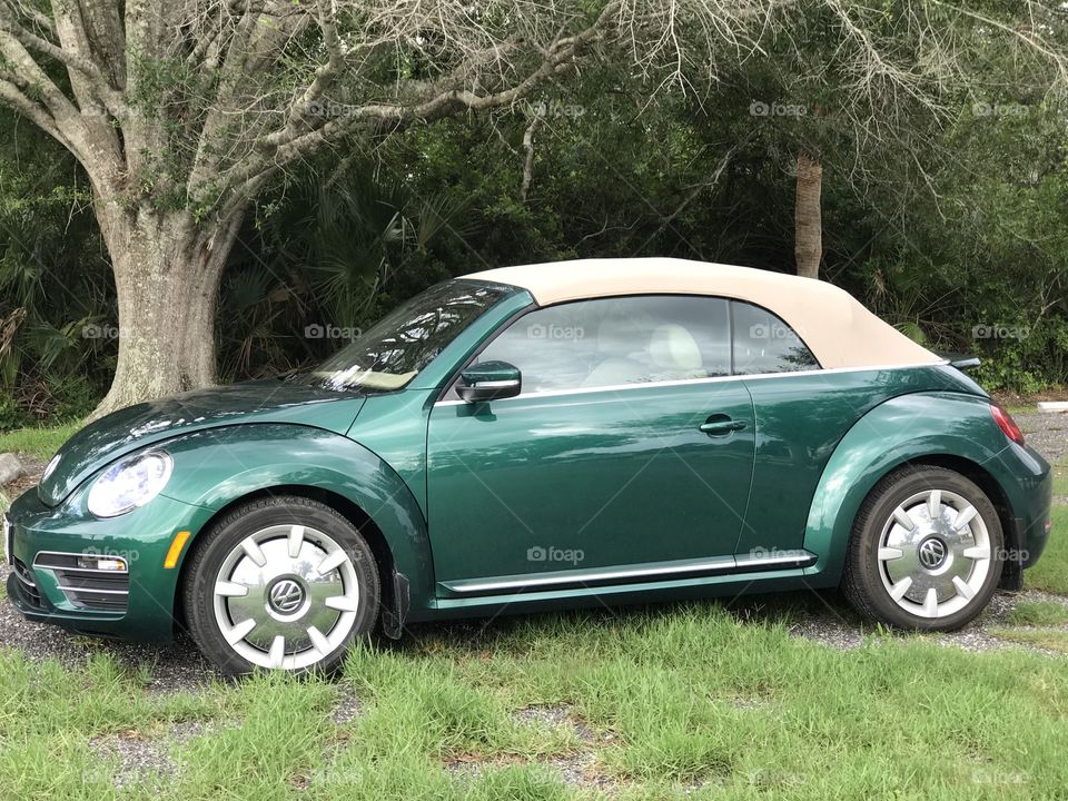 Shiney green VW convertible 