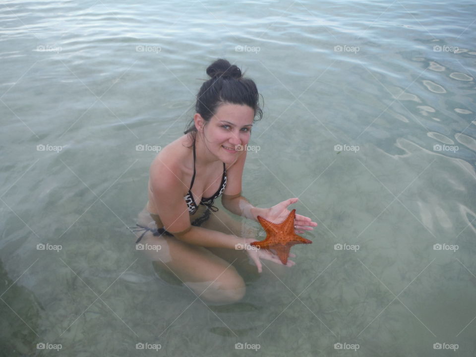 woman and starfish