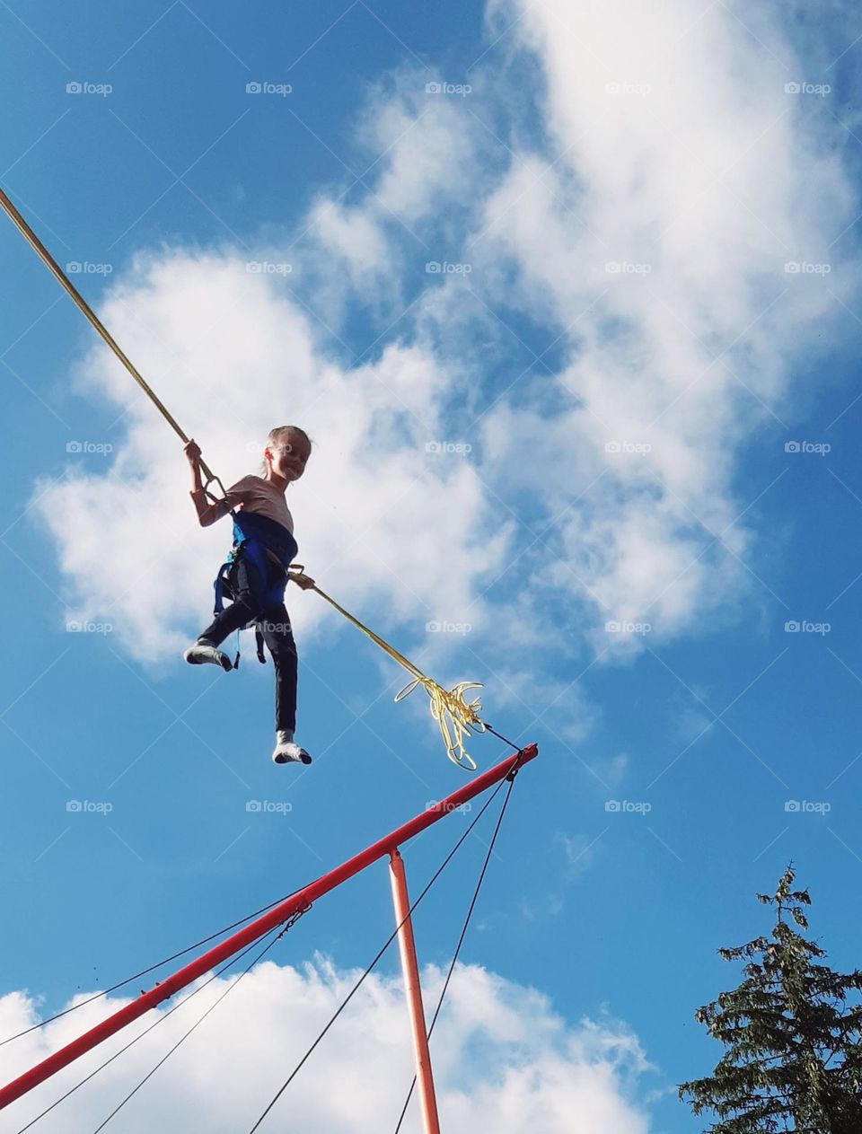 jumping high to reach the clouds