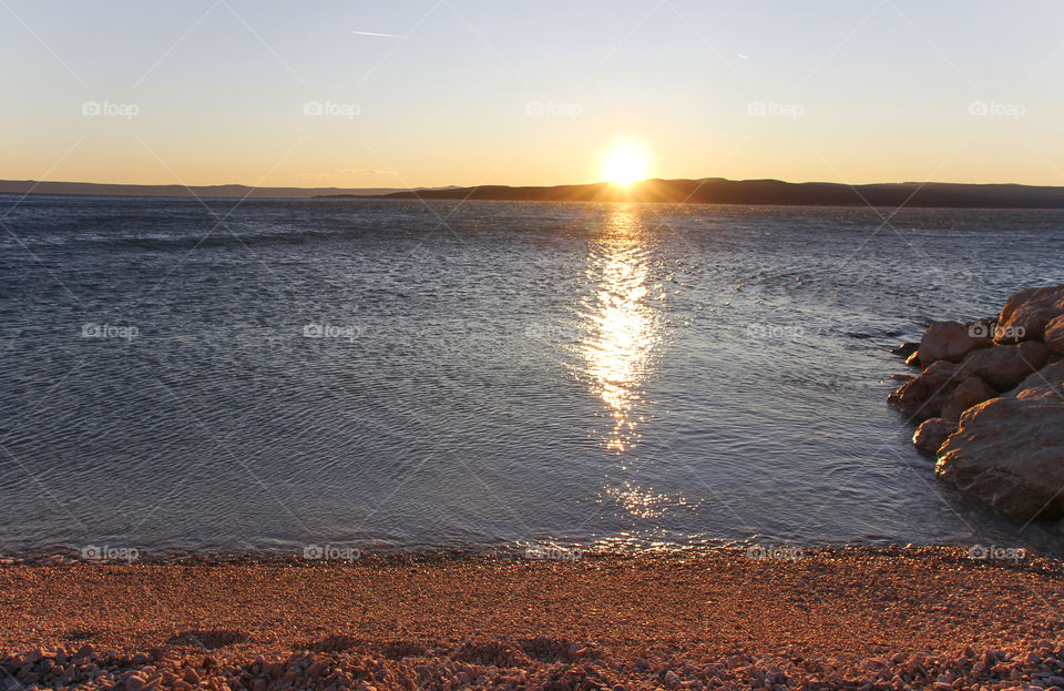 Winter sunset on the empty beach