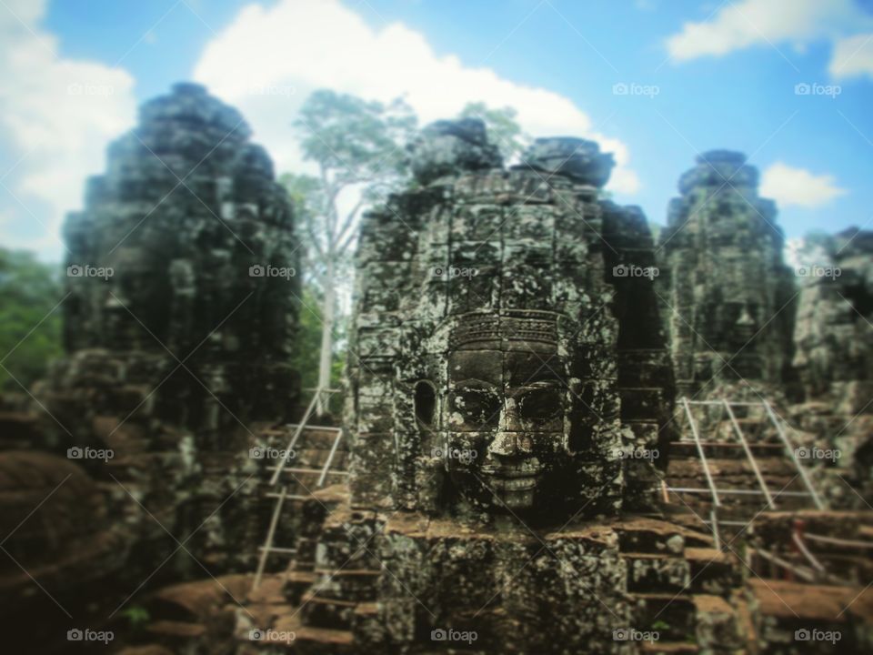 The Temple of smiles . The Bayon temple, also known as the temple of smiles is a part of the Angkor temples in Siem Reap, Cambodia