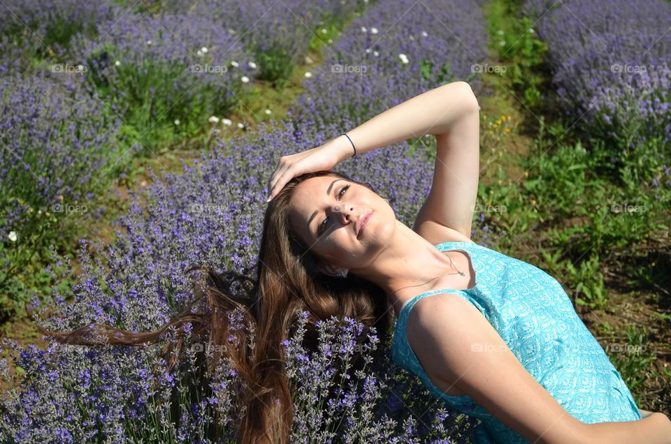 Beautiful girl in lavender fields