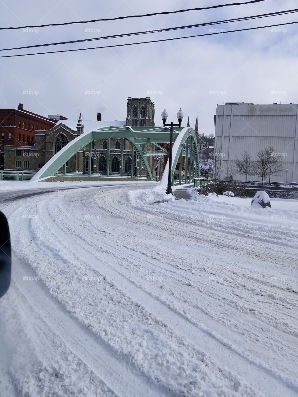 bridge in Oil City, PA during the winter of 2017 taken within a vehicle  out the passenger window