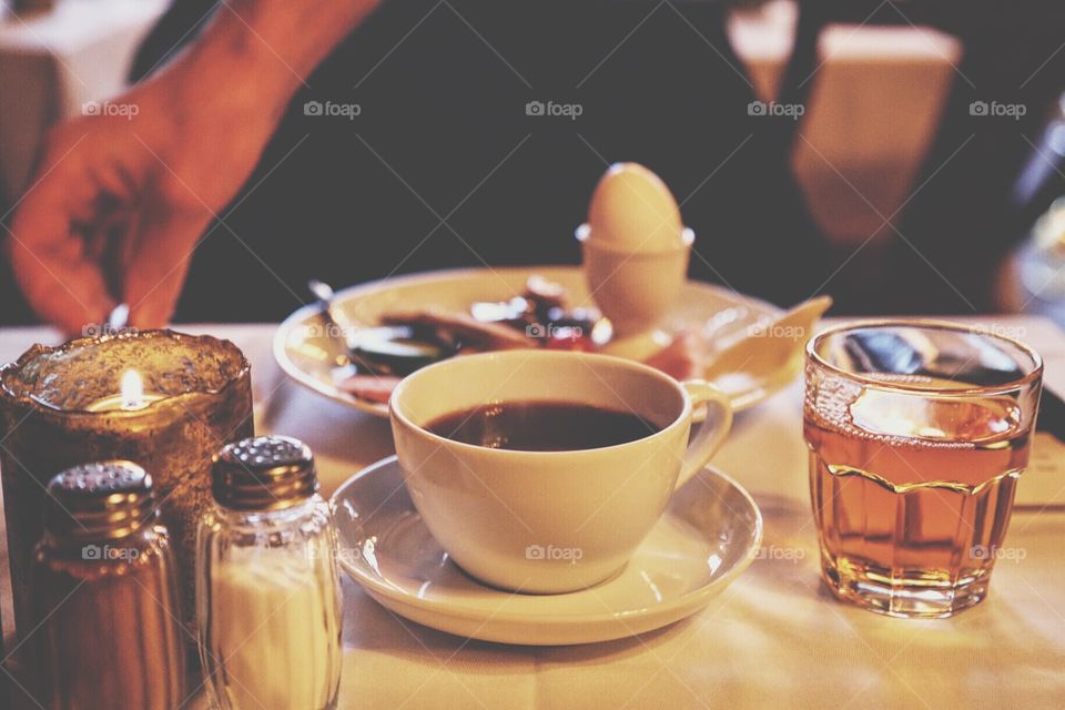 Hotel breakfast with coffee , apple juice and egg
