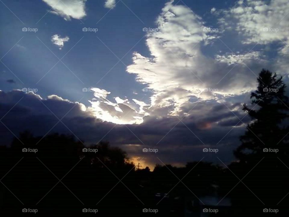 sunset through clouds