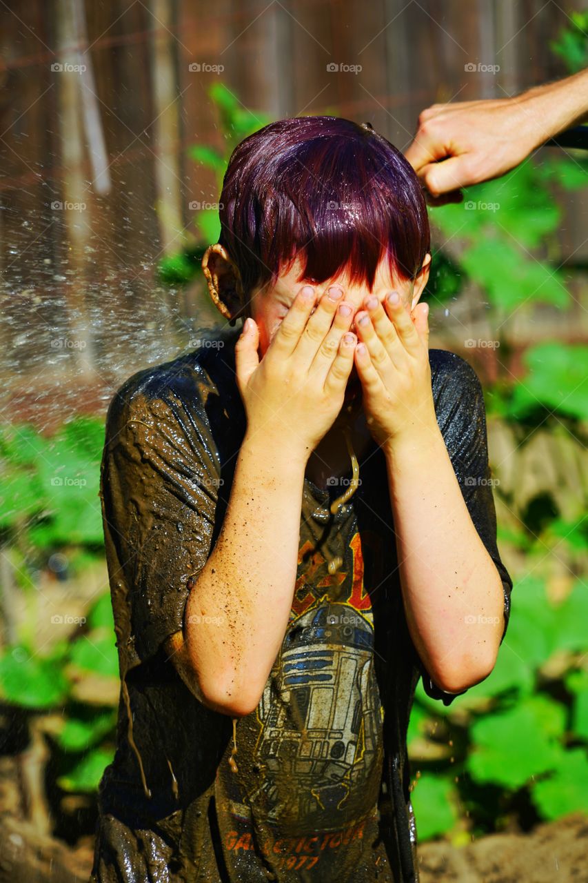 Boy Sprayed In The Face With Water