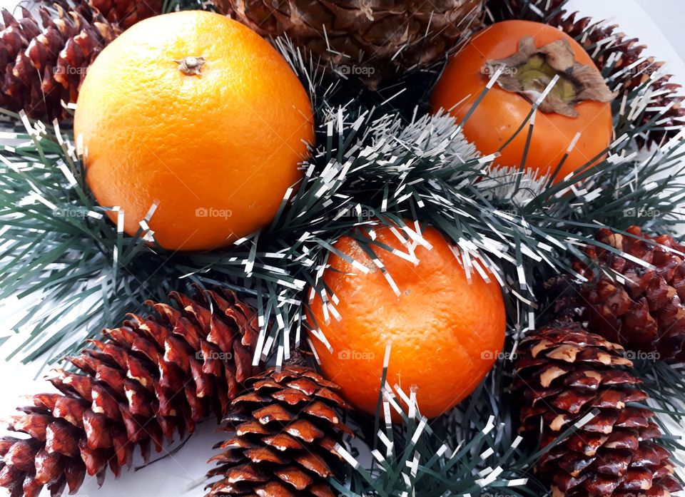 Christmas decorations of fruits and cones
