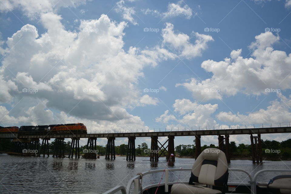At the San Jacinto River watching a train go on the rail road bridge we were going under
