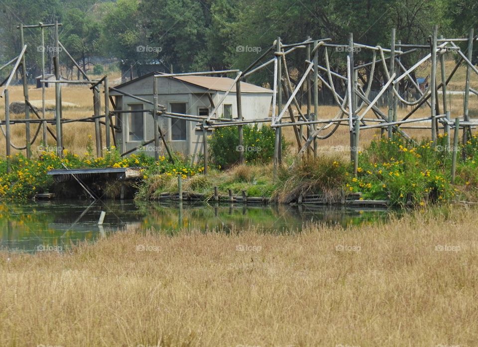 An unused monkey playhouse and structure reflecting in a field at the Wildlife Safari in Winston in Southern Oregon. 