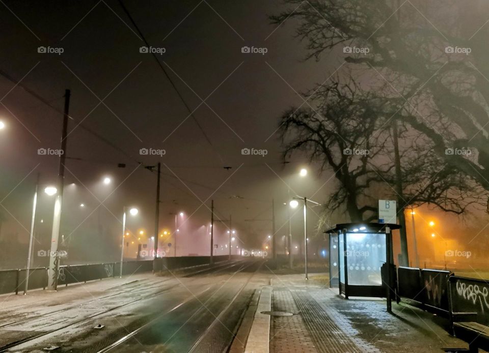 Foggy morning at the tram stop