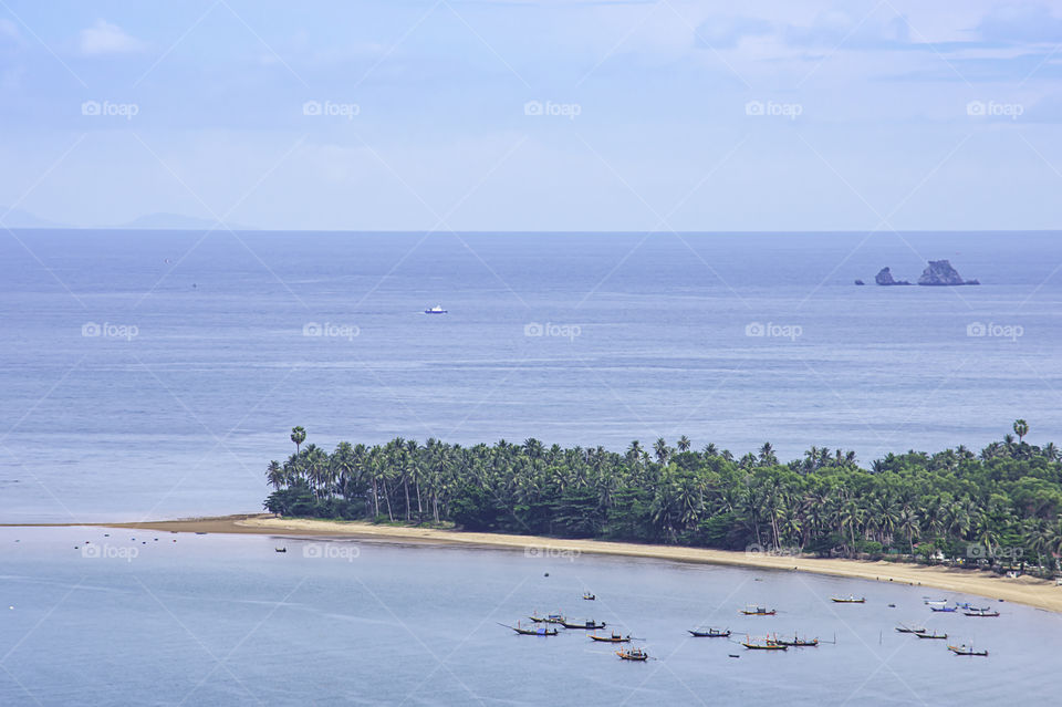 Fishing boats parked on the sea at Laem thian beach in Chumphon ,Thailand.