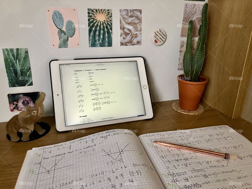 Desk with iPad and maths work