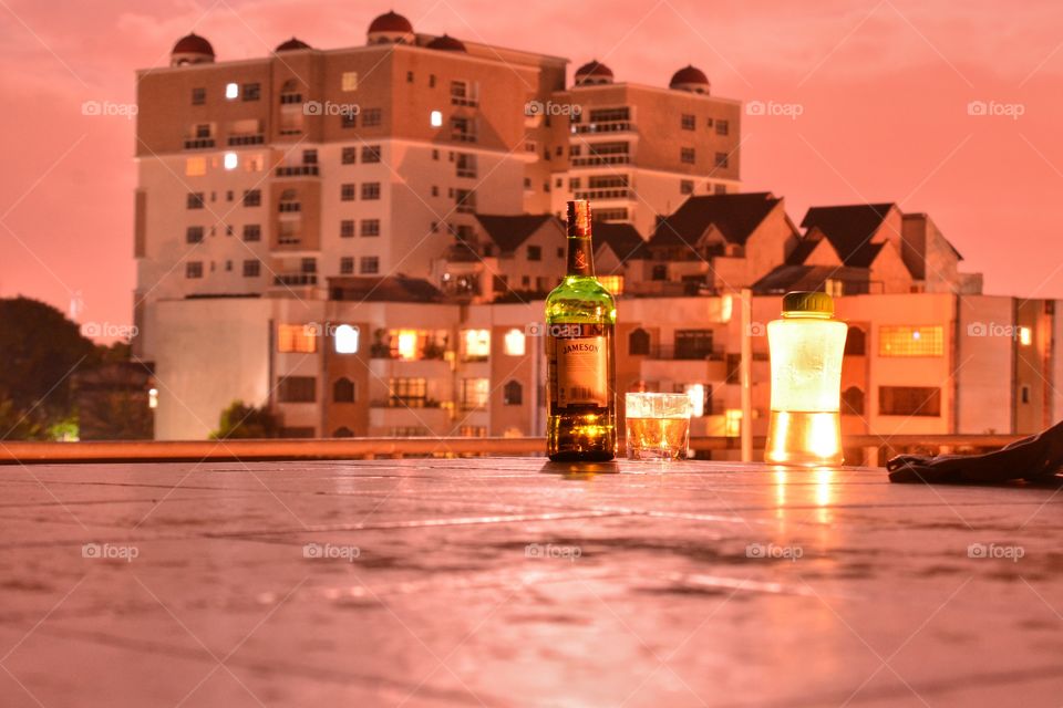 Pink skies and a little whiskey! Rooftop relaxation at its best