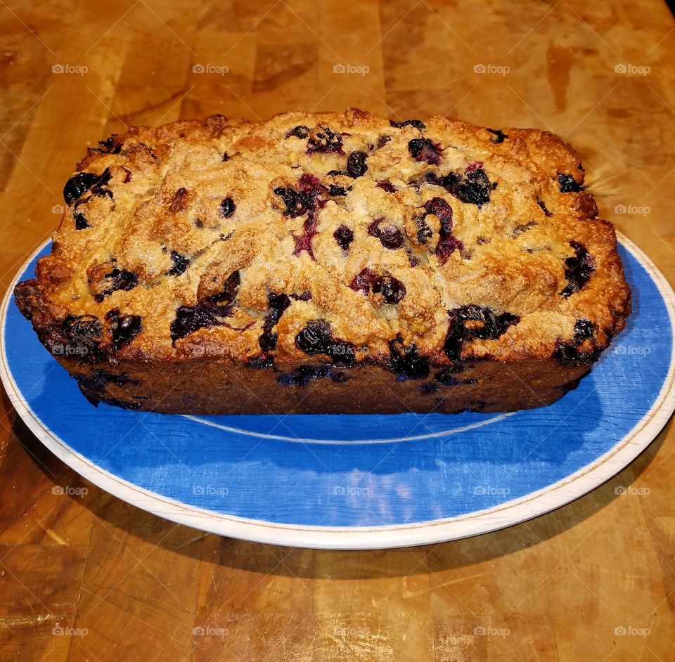 Blueberry Nut Bread on a blue plate.