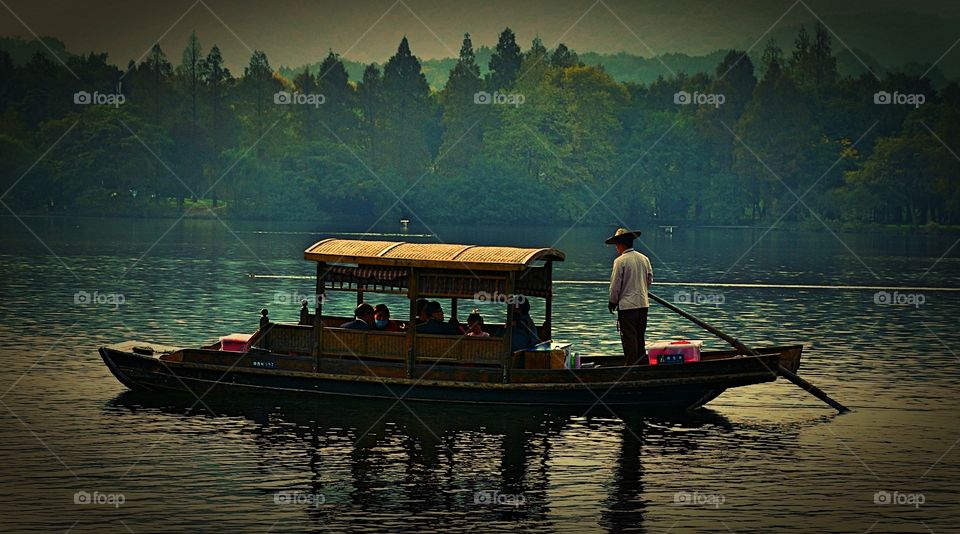 Boat on the lake - exploring West Lake in Hangzhou 