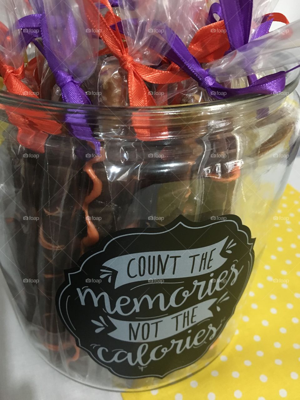 A Jar of Pretzels covered in chocolate 