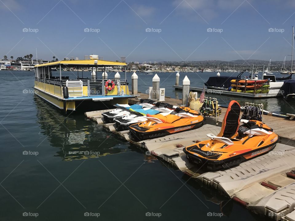 Colorful boat and jet skis at Redondo beach 