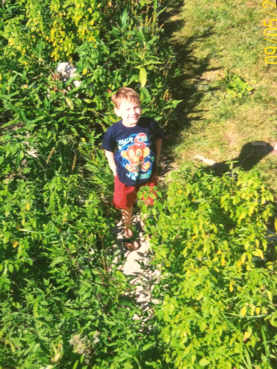 Boy standing in field