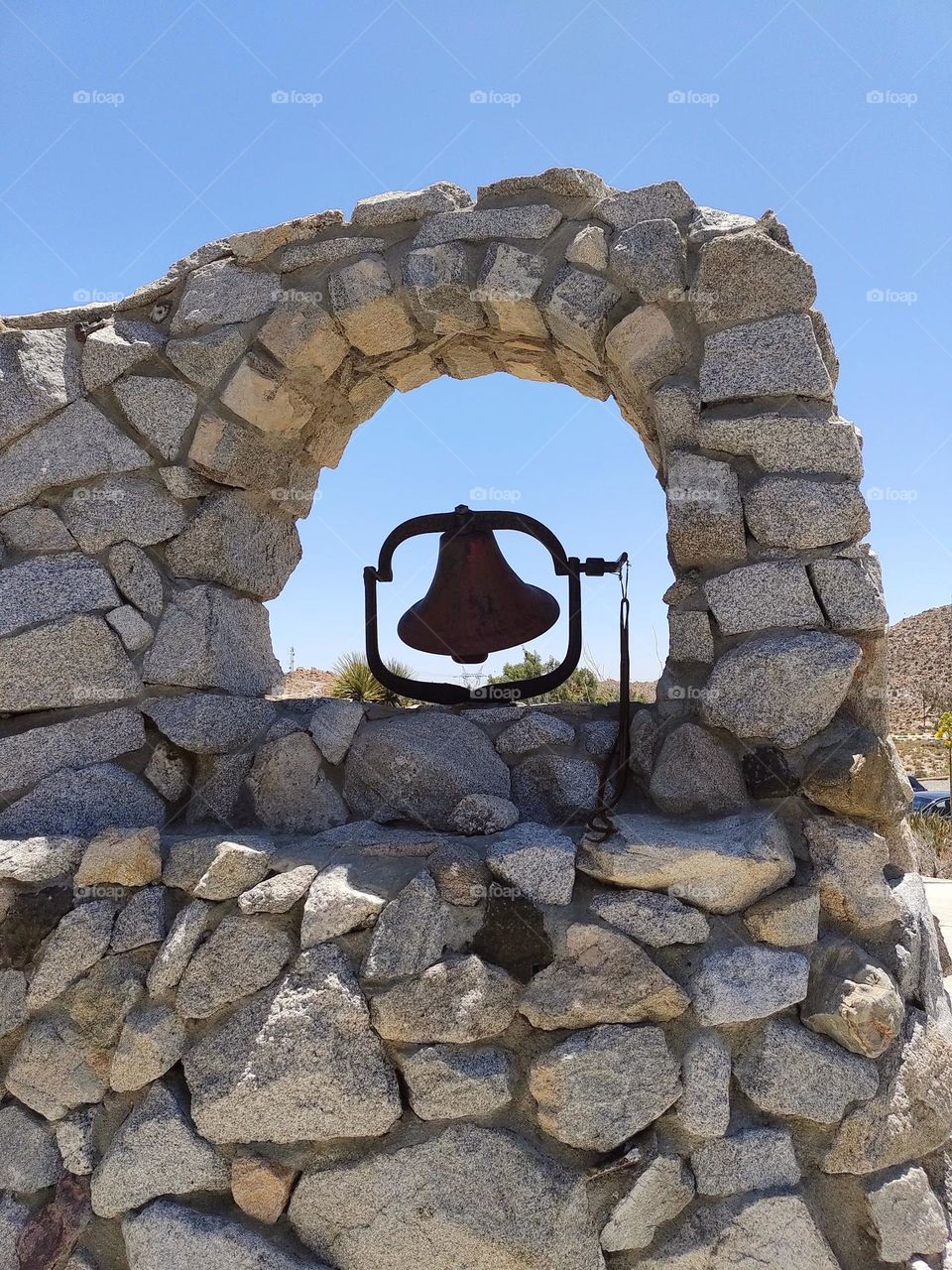 Mission style bell (one of several) located at the Desert View Tower State Historic Park site at In-Ko-Pah park road in extreme Southern California.