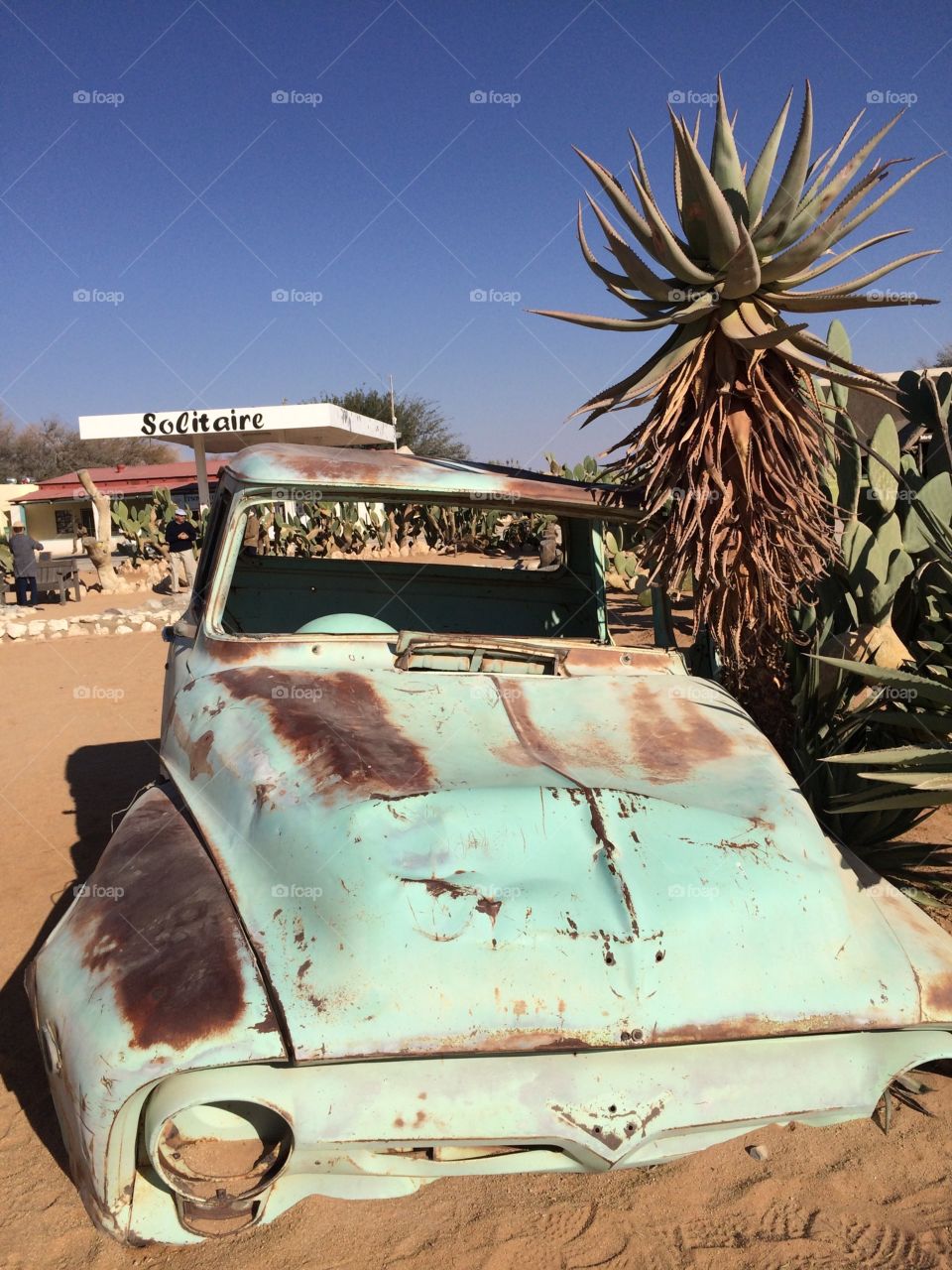 Abandoned rusty old car in desert landscape Solitaire, Namibia 