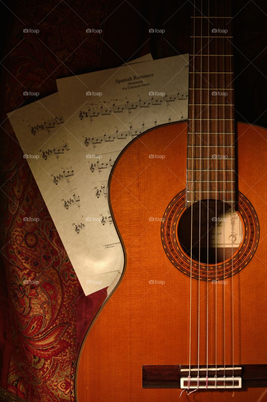 Flamenco guitar. Still life photo of my Flamenco guitar with Spanish Romance sheet music.