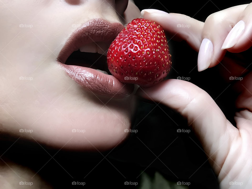 Eating a strawberry 