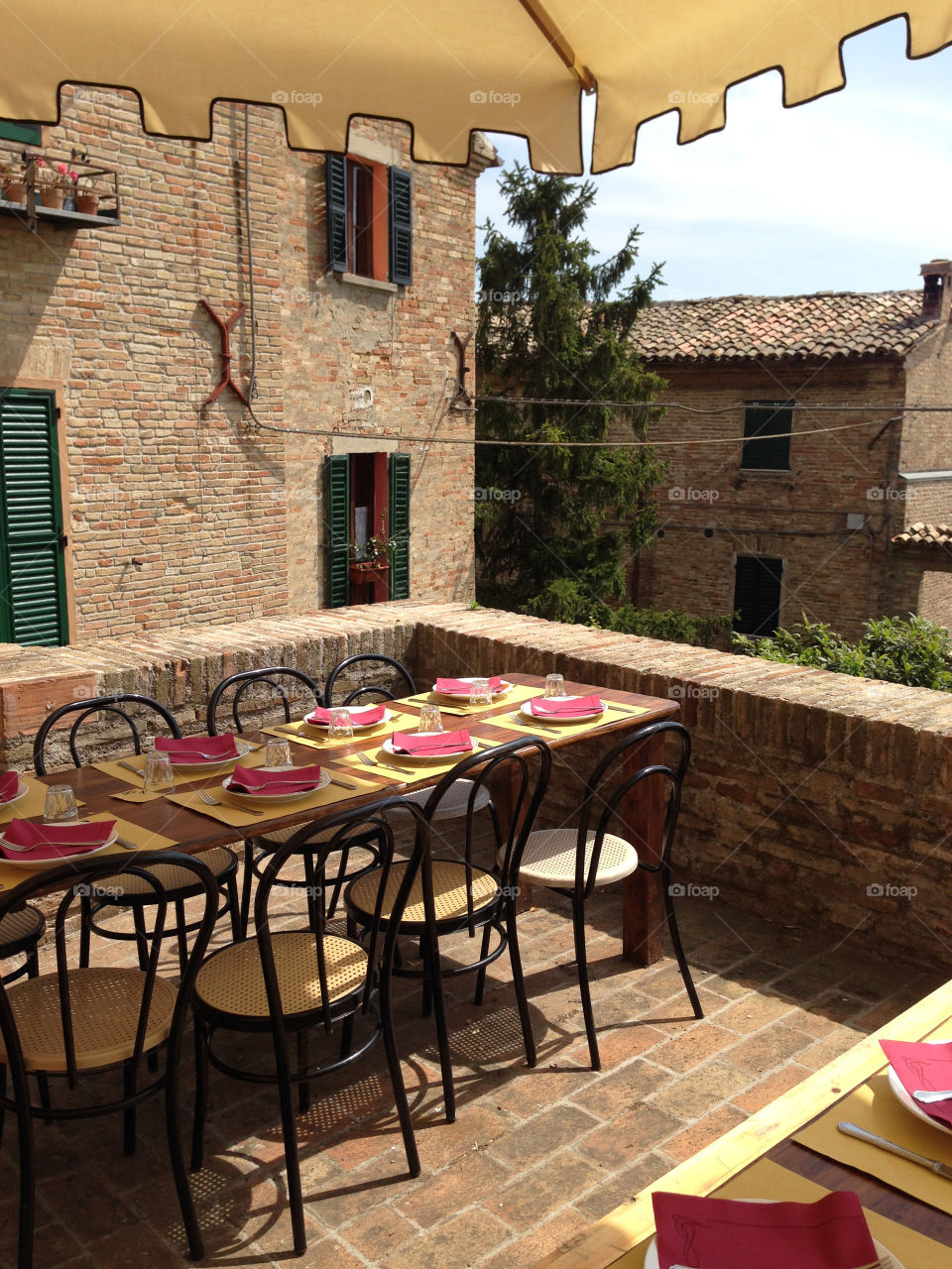 A table set ready to eat in the heart of a old village