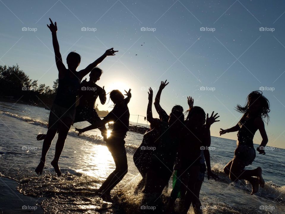 Children silhouette at the beach