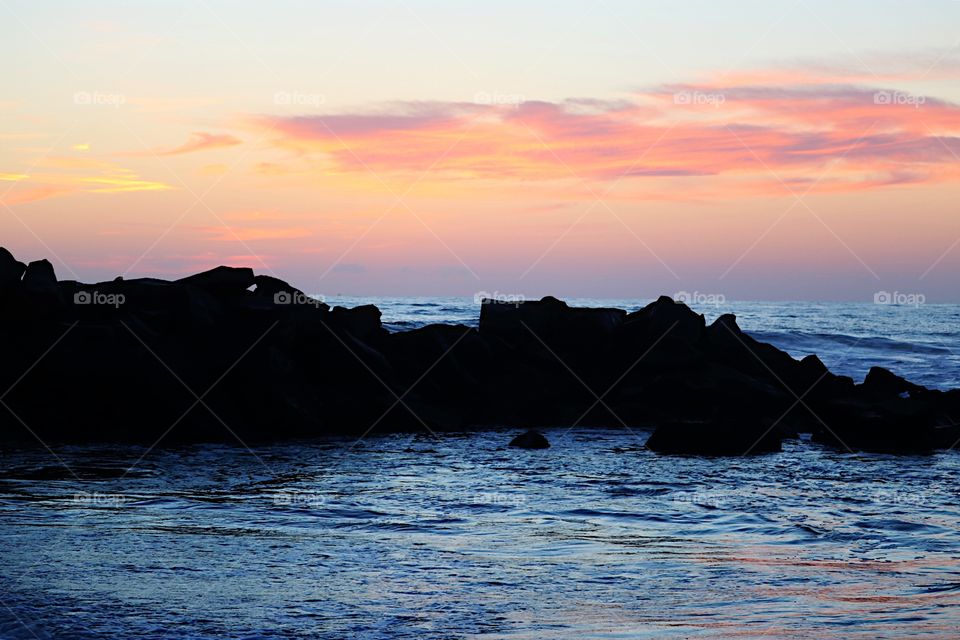 Sunset over the jetty in Venice Beach, CA