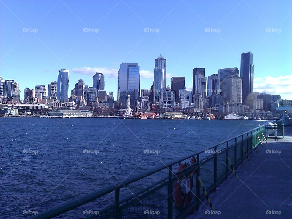 Seattle Skyline From Ferry. A view of the Seattle skyline taken from a ferry traveling across puget sound.