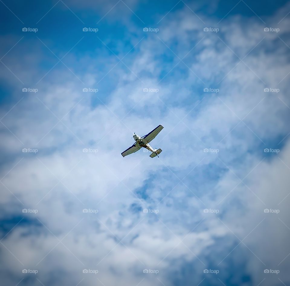 A small plane flying low to the ground—taken in Valparaiso, Indiana 