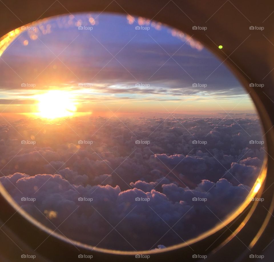 View of setting sun from airplane